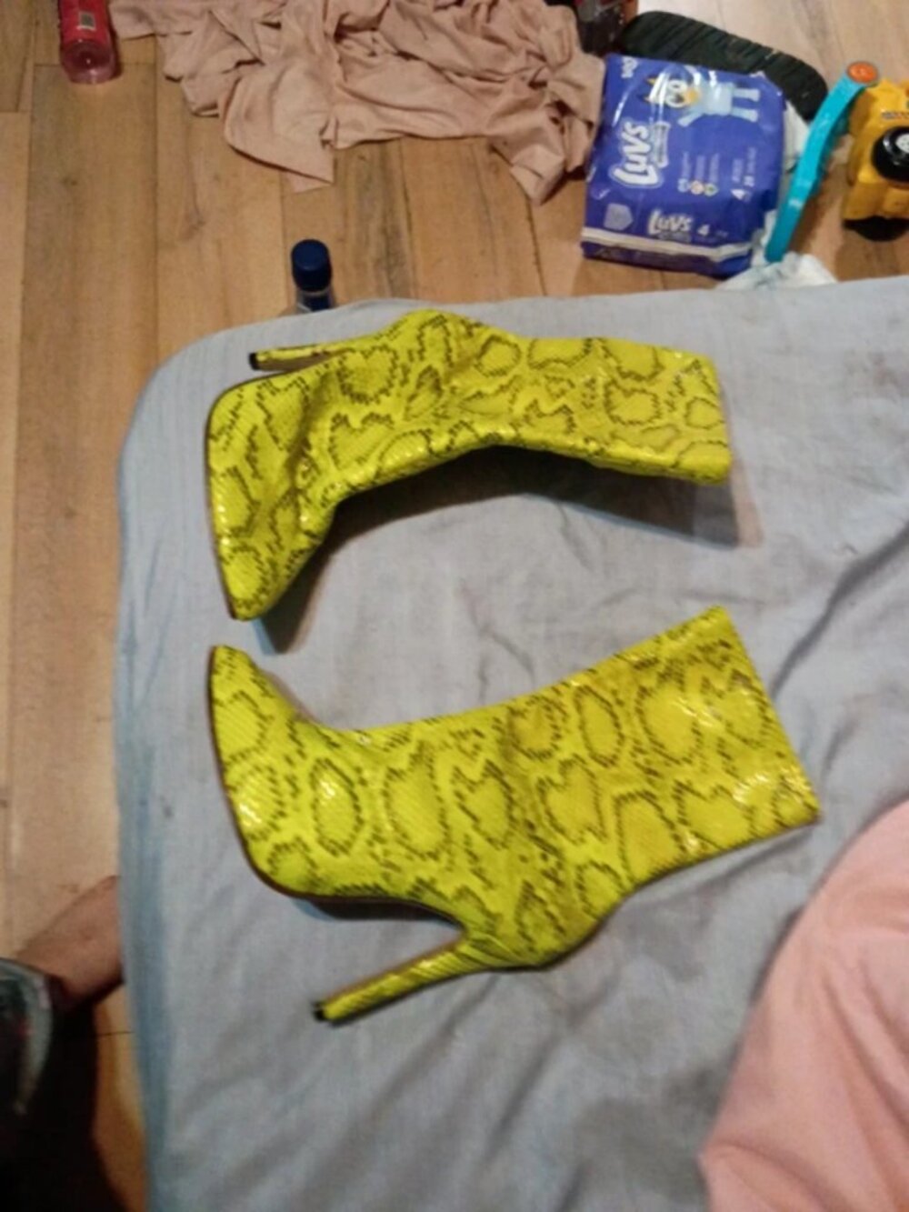 She & in neon green snake print high heels